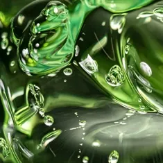 Green plant extract liquid with bubbles, standing in for senna leaf extract